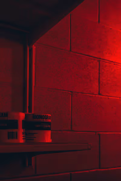 toilet paper in a red lit bathroom at night