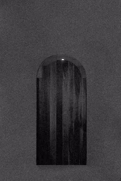 a grainy door floating in the middle of nowhere