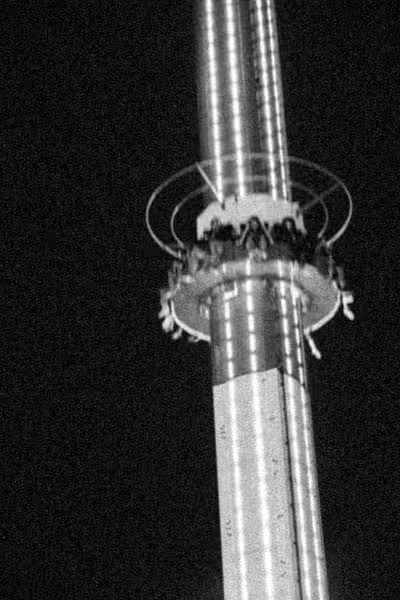 fantasy island amusement park lighthouse ride at night with motion