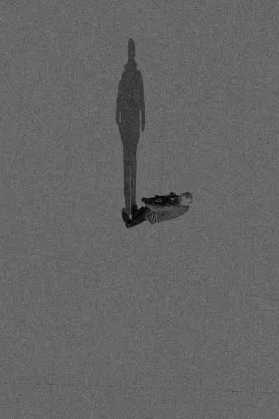 man walking vertically up a building