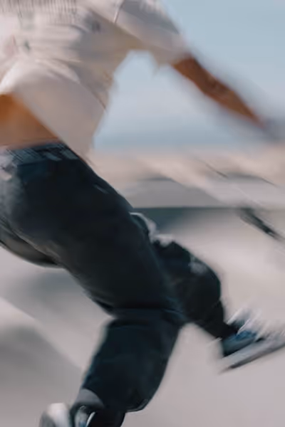 Venice Beach skateboarder in motion falling in the pool