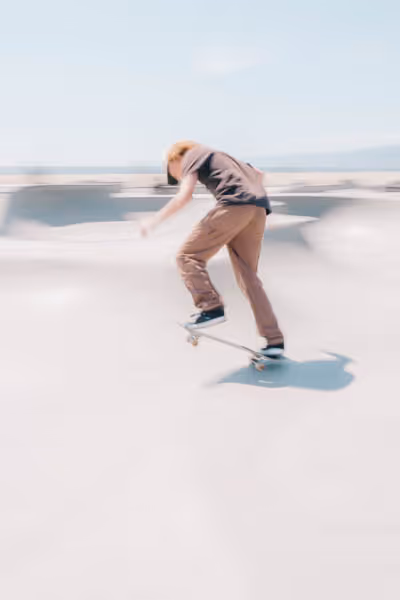 Venice Beach skateboarder in motion on a sunny day by the beach