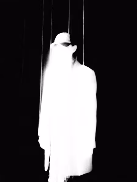 a ghostly black and white woman in a hat