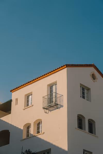 the Juliet balcony of a building at sunset in Los Angeles, California