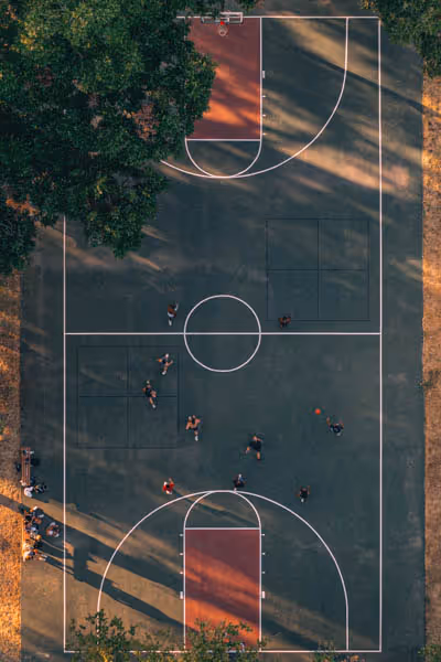 red and green basketball court as seen from above in Austin