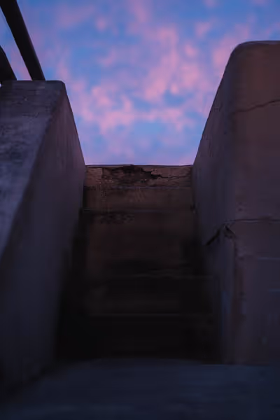 Pink and purple sunset over outdoor stairs