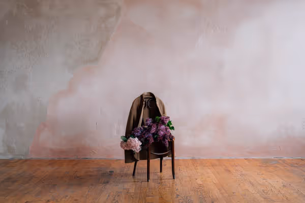 lilacs and hydrangeas flower bouquet on chair with felted jacket