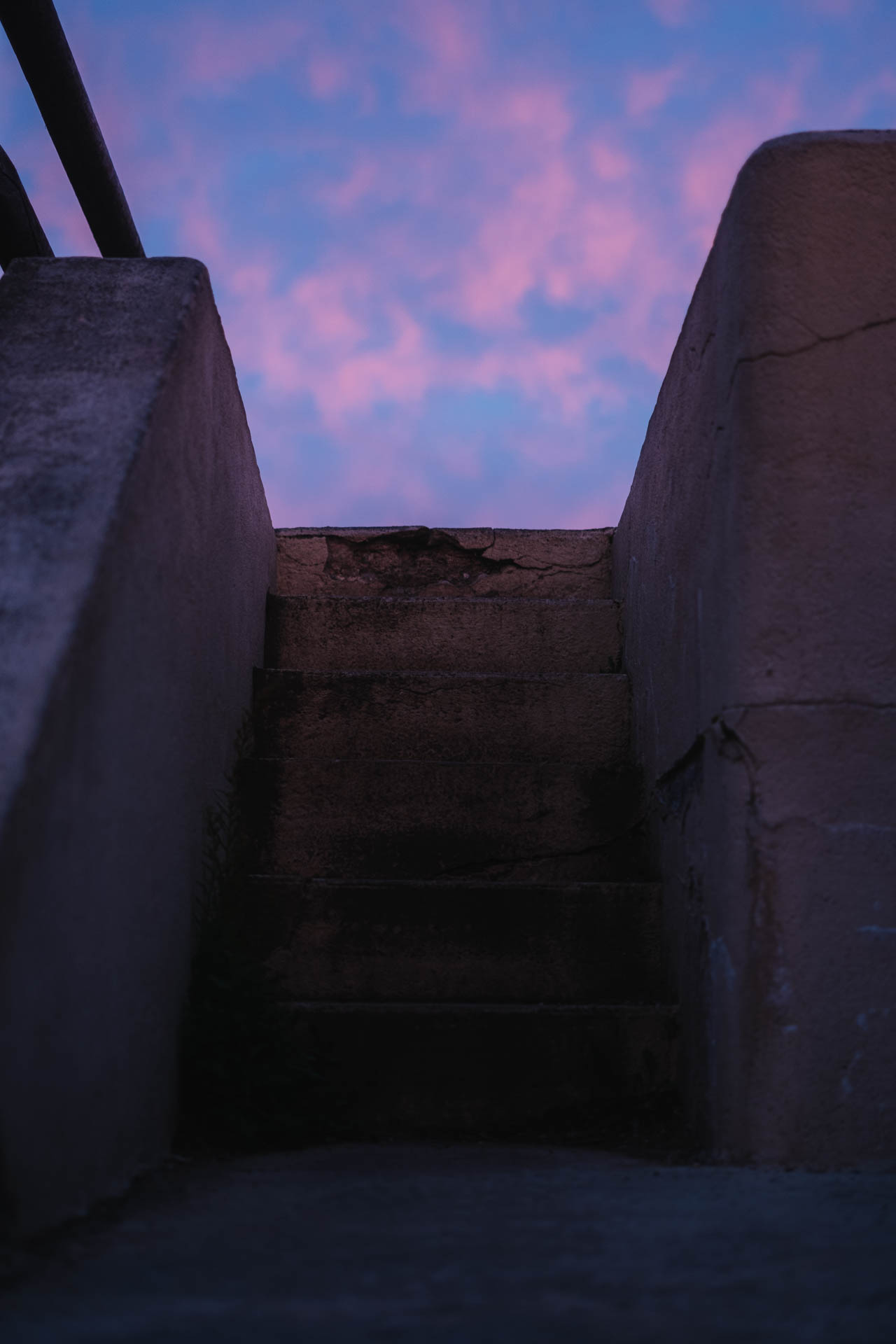Pink and purple sunset over outdoor stairs