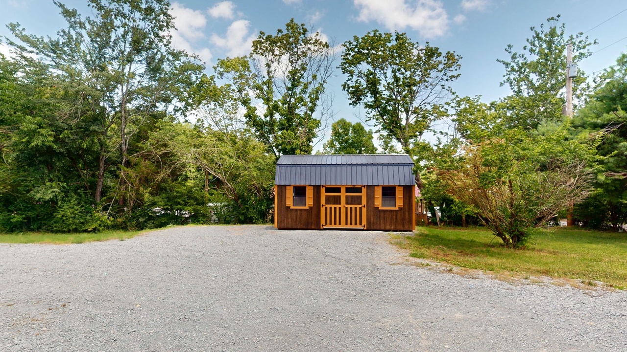 Storage building on the gravel drive