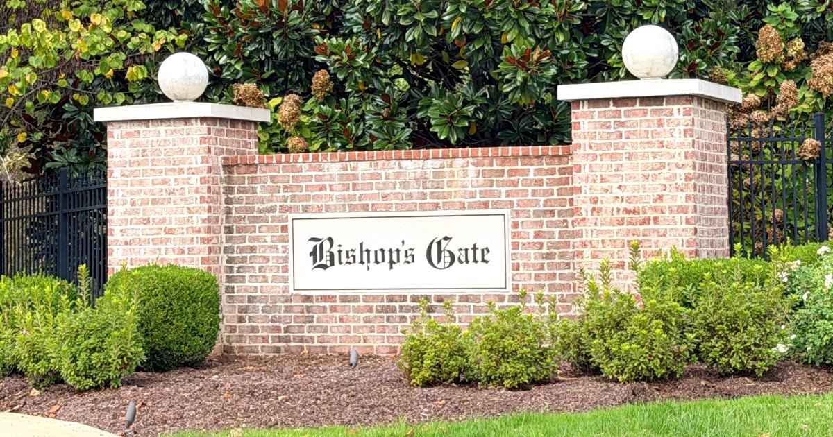Bishop's Gate brick entrance wall with globe-topped columns and iron gate, Franklin, Tennessee