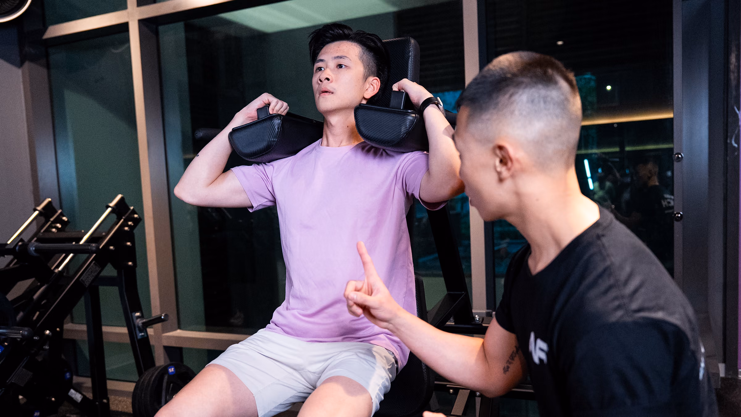 woman training with rope and personal trainer