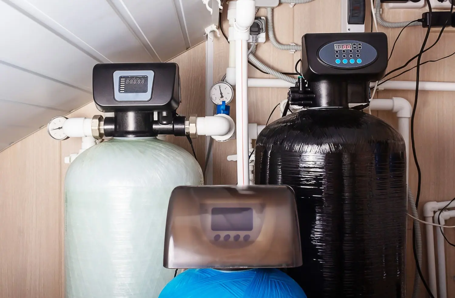 Image of a man working on kitchen plumbing