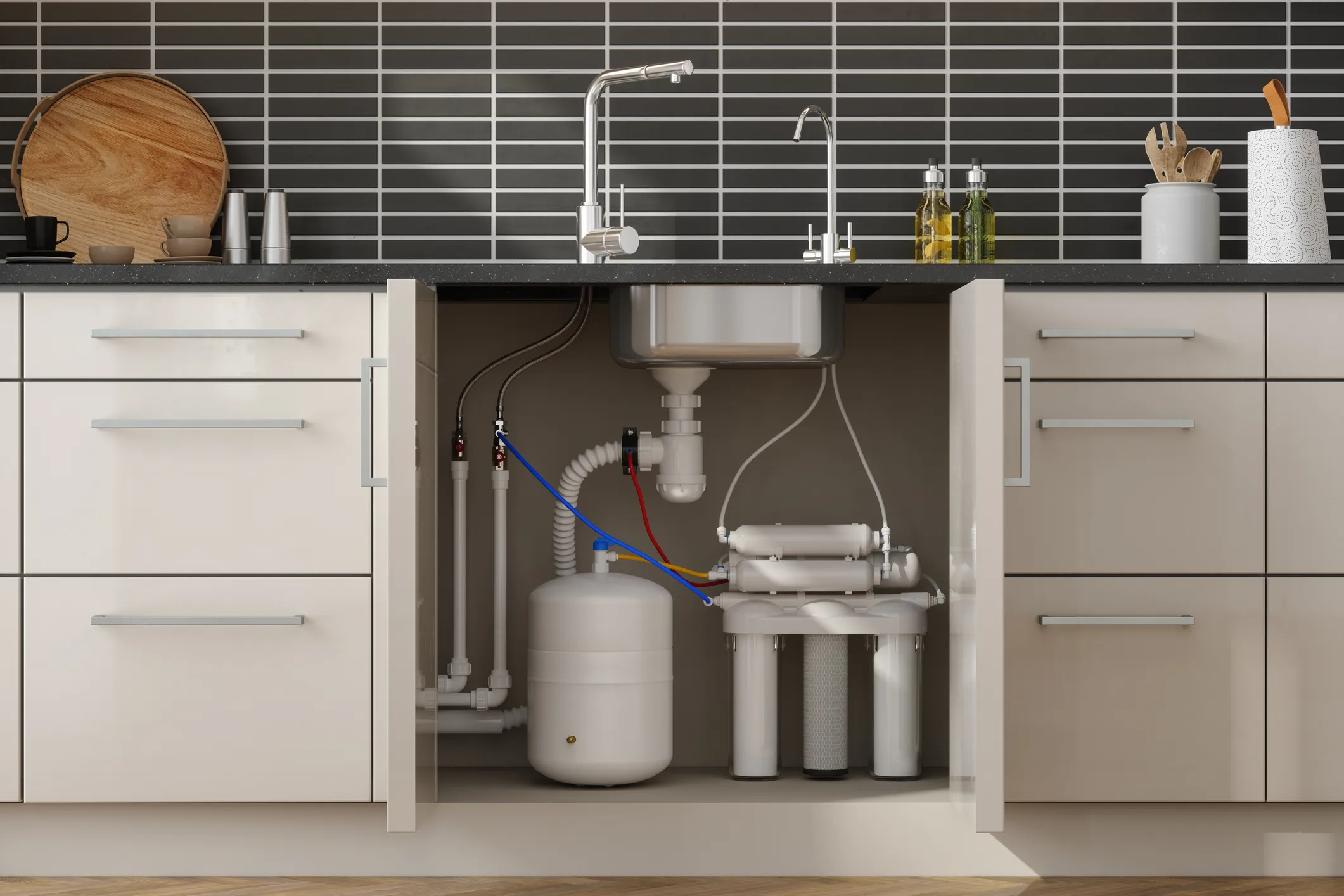 A water filtration system is installed in the basin of the kitchen
