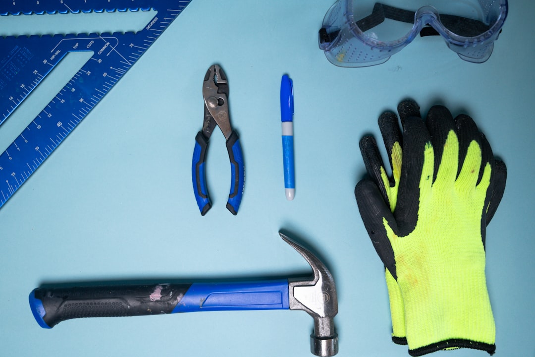 Necessary tools and safety gear laid out on a tarp for water heater removal - old water heater removal