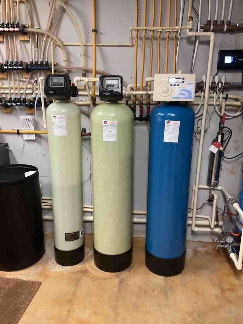 professionally installed acid neutralizer system in a clean basement - acid neutralizer frederick md
