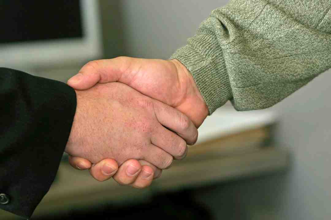homeowner shaking hands with plumber - affordable plumbing installation in green valley md