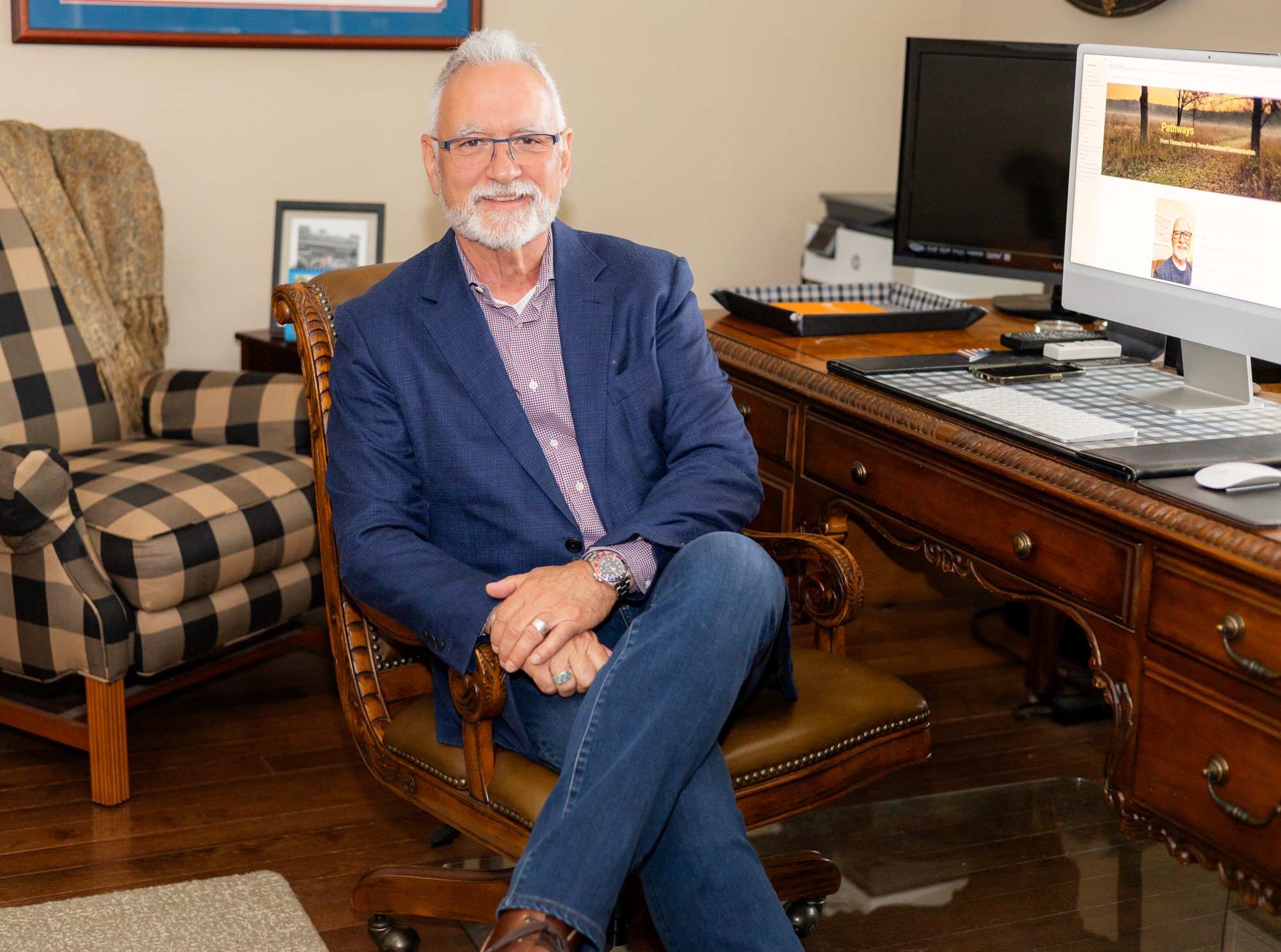Keith Burton seated in his office