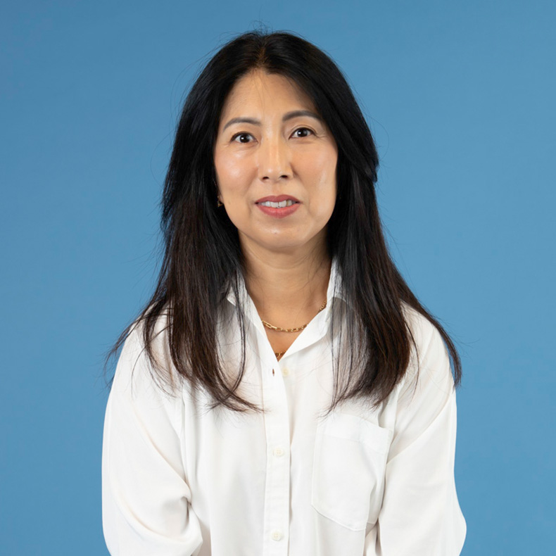 A woman wearing a black shirt.