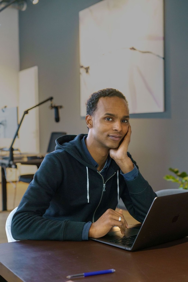 Mohamed Sahardid, SEO and GEO specialist, working at his laptop