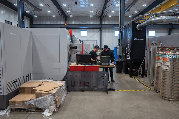Two people working in a factory.