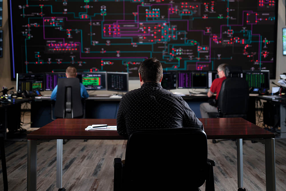 Power system operators evaluating the electric system and power grid.