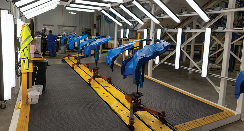 Inside of a factory with bright lighting and advanced electronics.