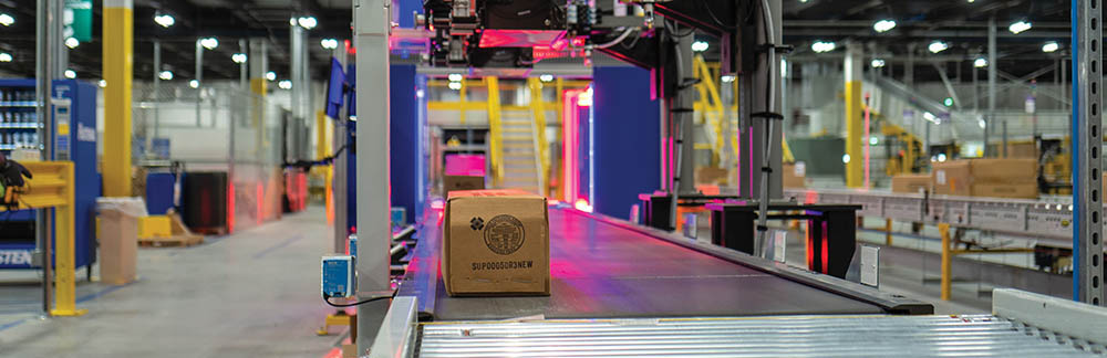 A box on a conveyor belt in a factory.