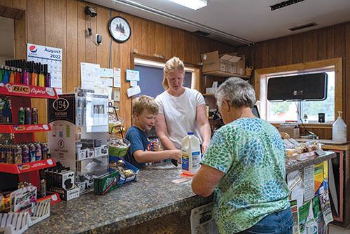 Woman working in a grocery store in rural North Dakota.