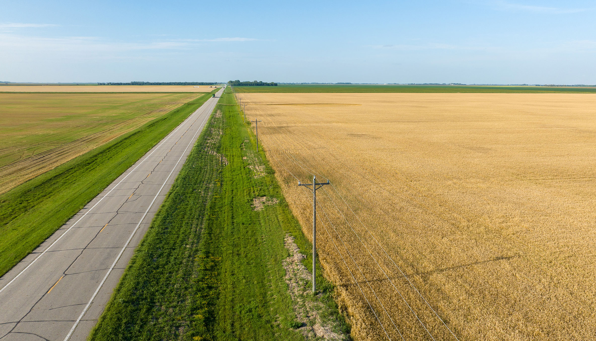 Farm field and a country highway in North Dakota.