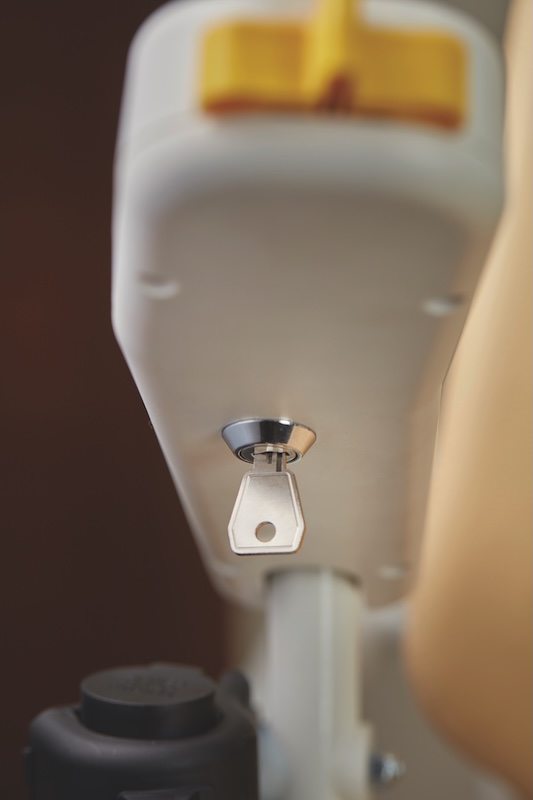 "Close-up of a stairlift safety key switch, ensuring secure and controlled use at home."
