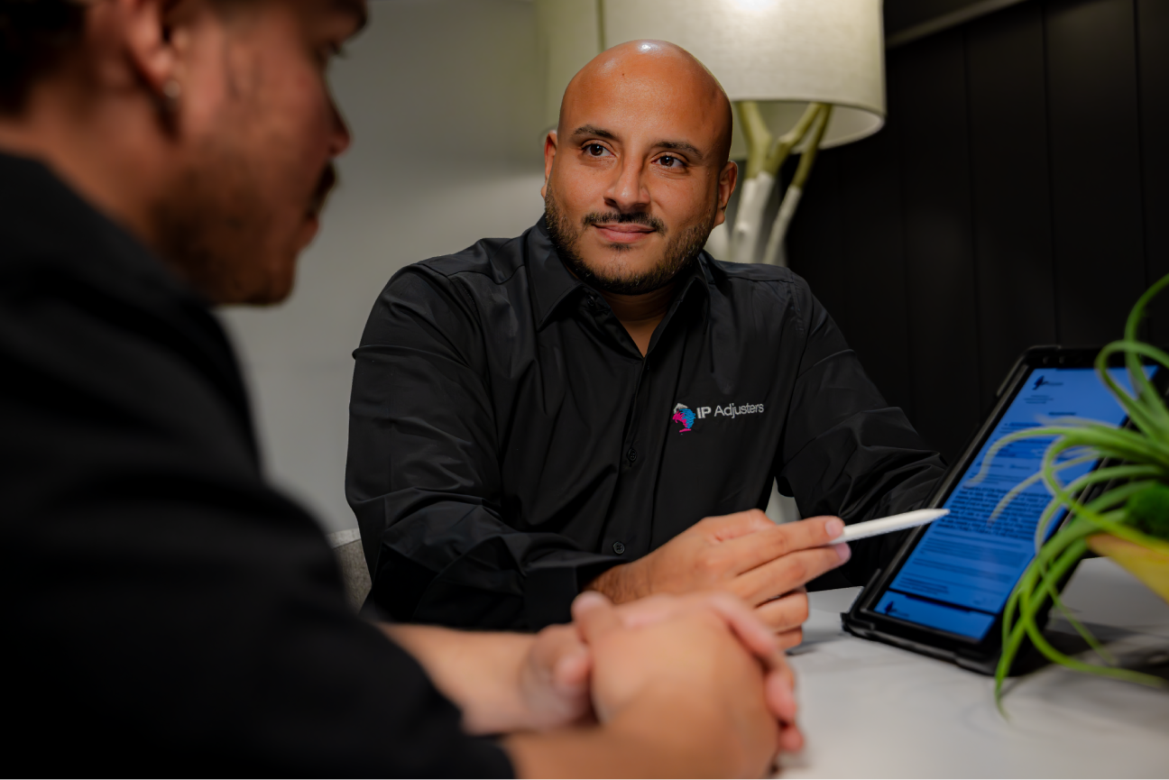 One of the IP Adjusting Group cofounders helping a client.