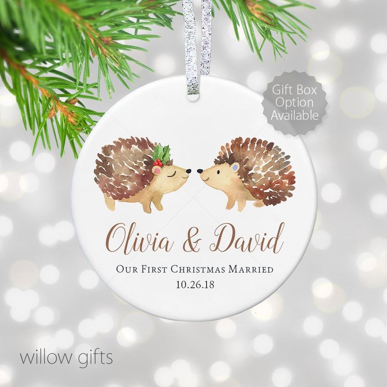 round white ornament with two hedgehog characatures painted on reading olivia and david our first christmas married 10.26.18
