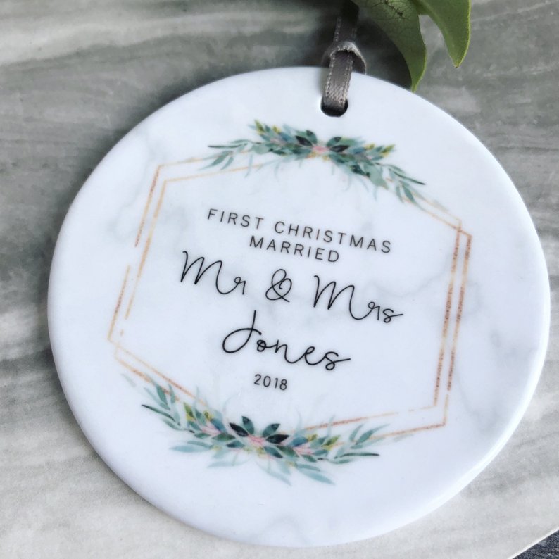clean round white marble ornament reading first christmas married mr and mrs jones 2018