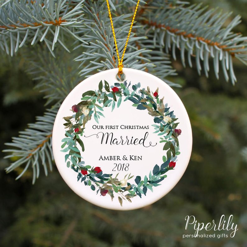 round white ornament reading our first Christmas married amber and ken 2018