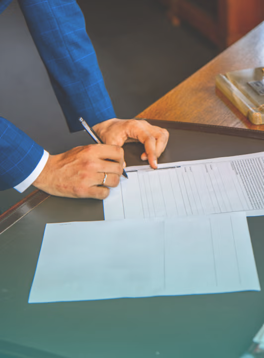 woman signing a document
