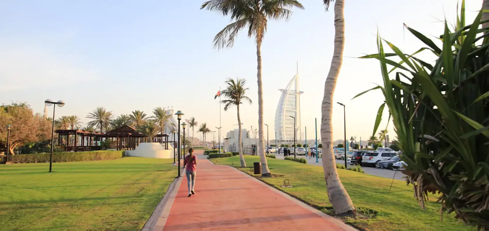 Scenic view of Jumeirah area in Dubai with palm trees and the Burj Al Arab in the background