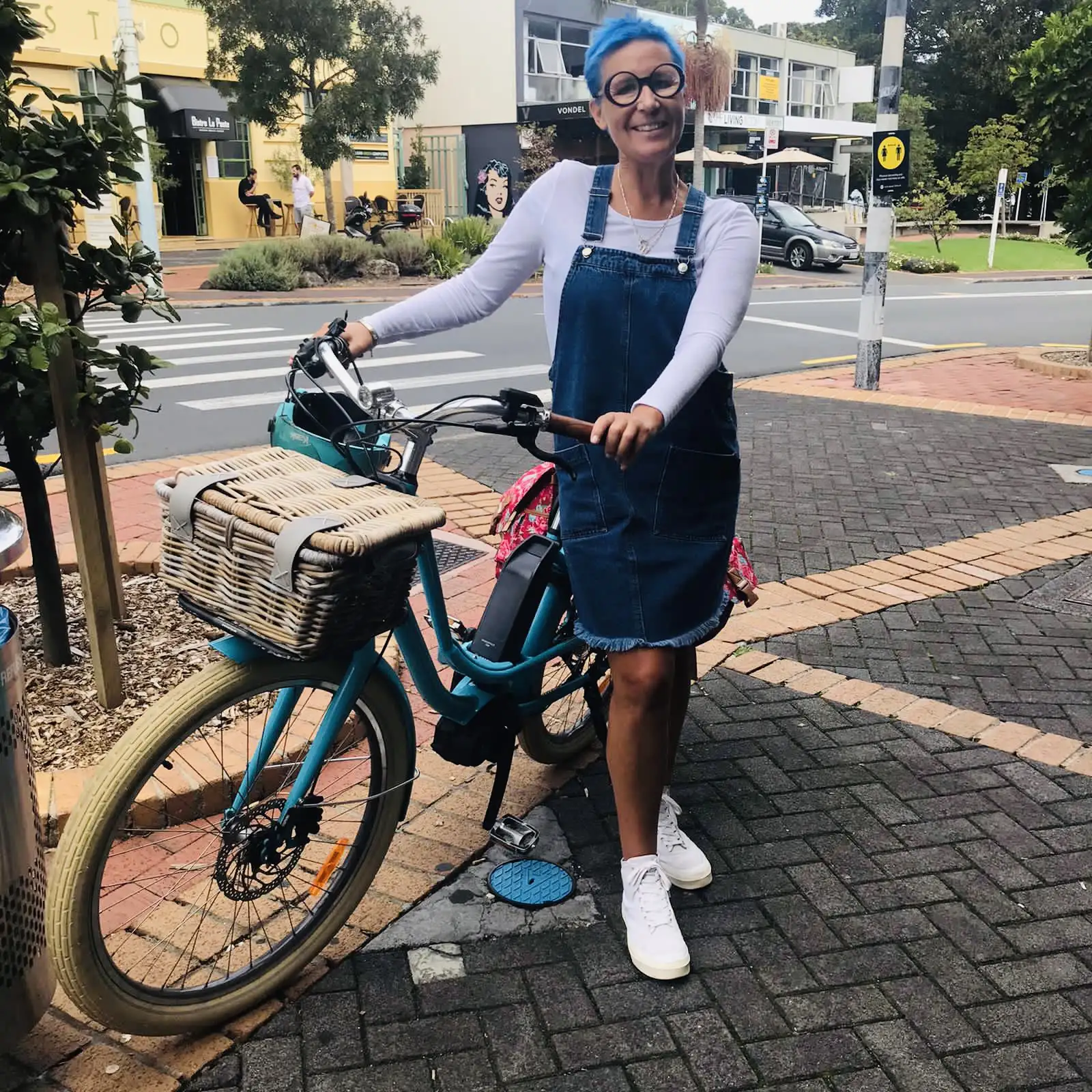 How Cycling Has Helped With My Parkinson’s. Nic Russell standing with her e-bike.