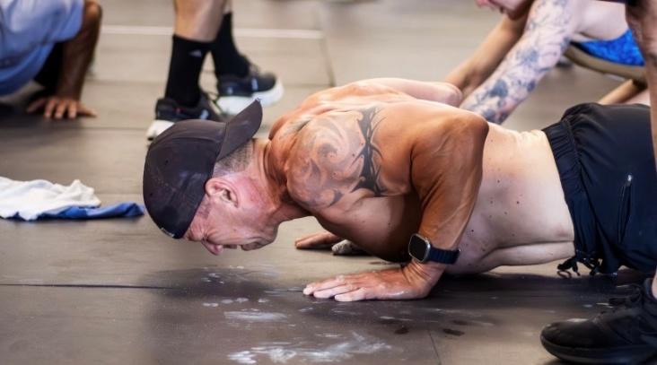 A person doing push ups on the floorAI-generated content may be incorrect.