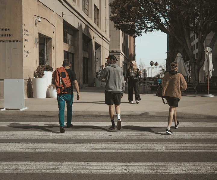 3 friends on the street, walking
