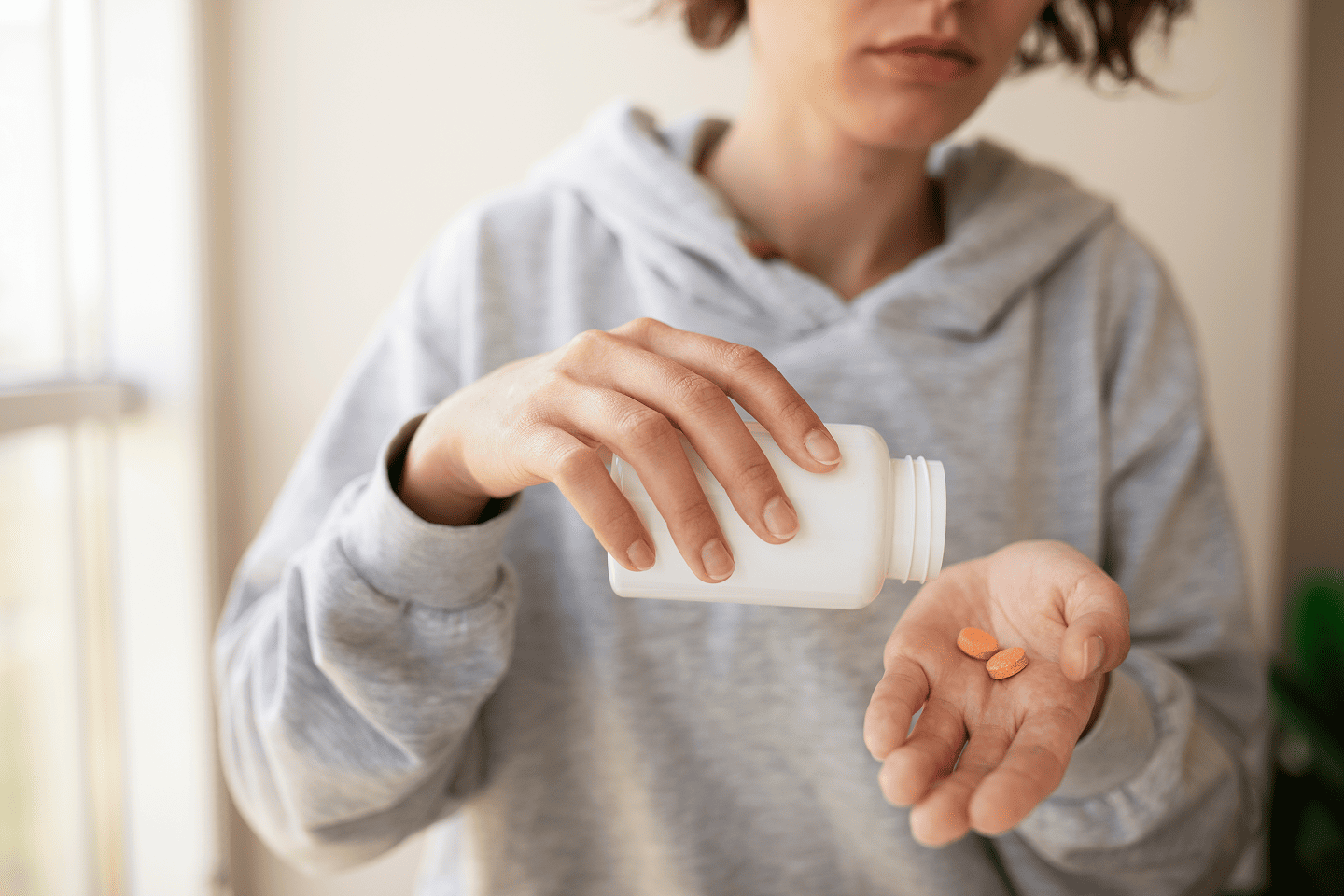 Woman taking pills