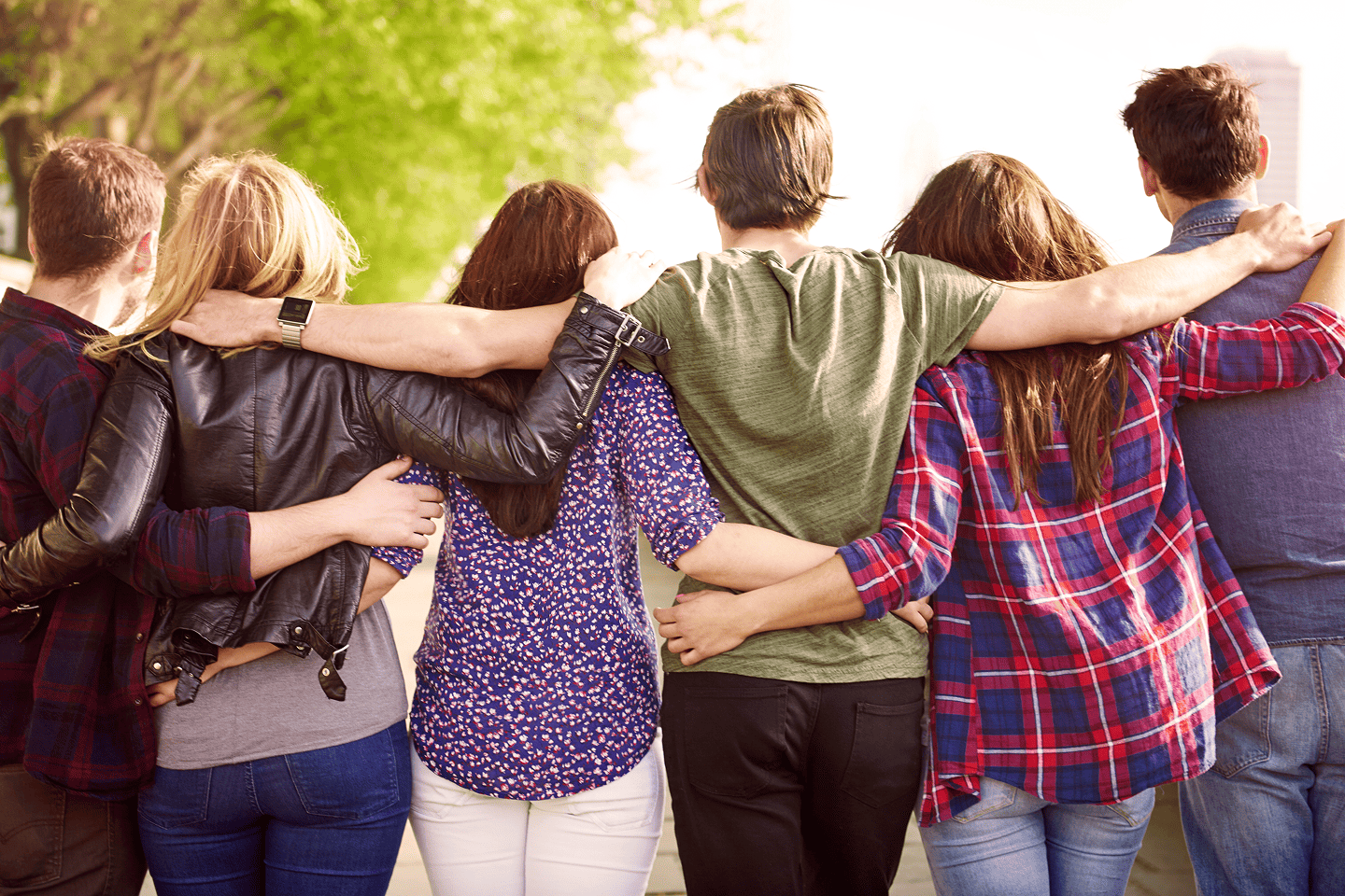 A large group of people hugging