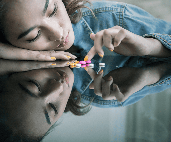 Woman taking pills