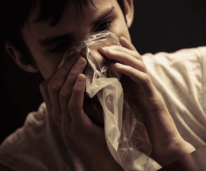 Man sniffing from the bag