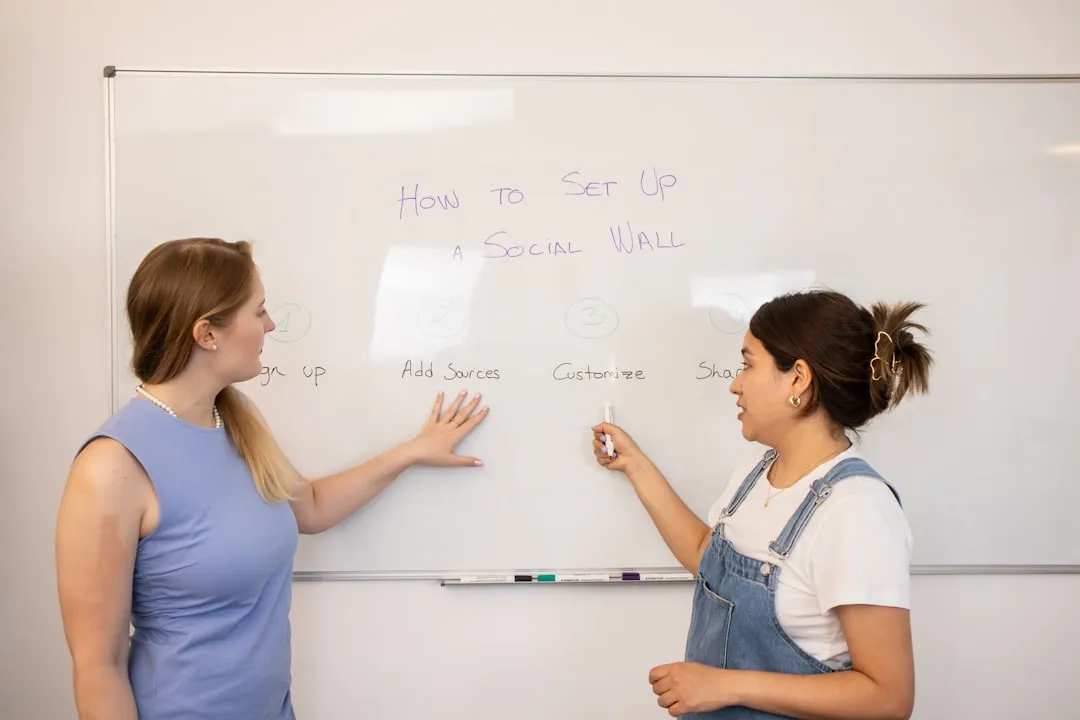 Developers collaborating on a whiteboard during a discovery session - App Development in Miami: The Complete 2026 Guide to Building Your Startup App in South Florida