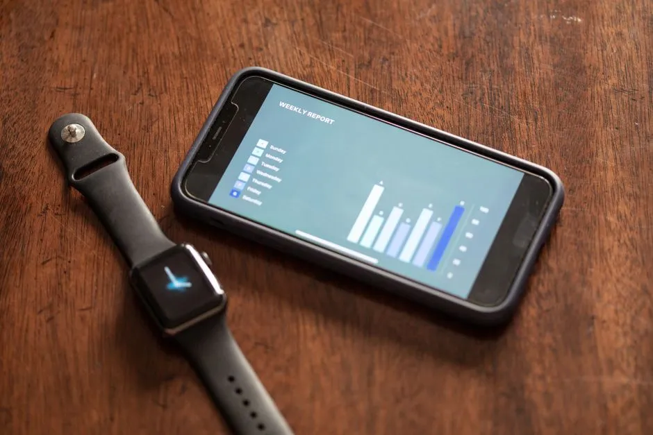 smartwatch connected to smartphone displaying health data - The Future of Mobile UX: Wearable Data, IoT Sensors, and Always-On Insights