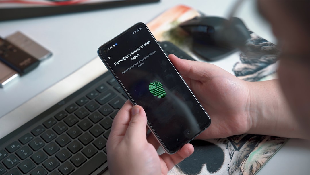 user unlocking smartphone interface with biometric fingerprint reader user unlocking smartphone interface with biometric fingerprint reader
