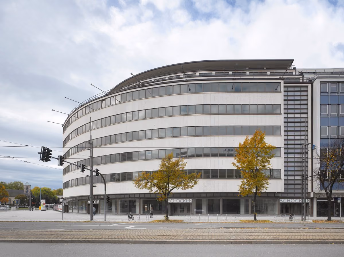 Energy consultant reviewing building certification documents and sustainability analysis