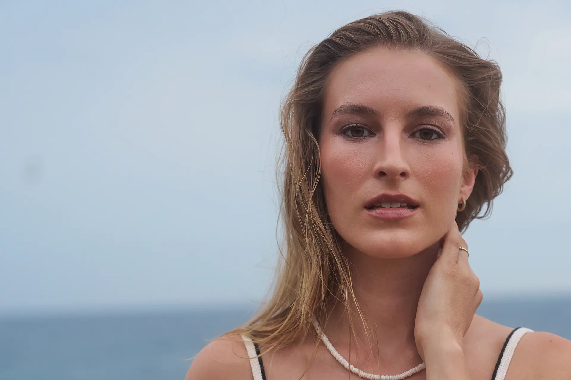 Young woman with a lifted, youthful expression