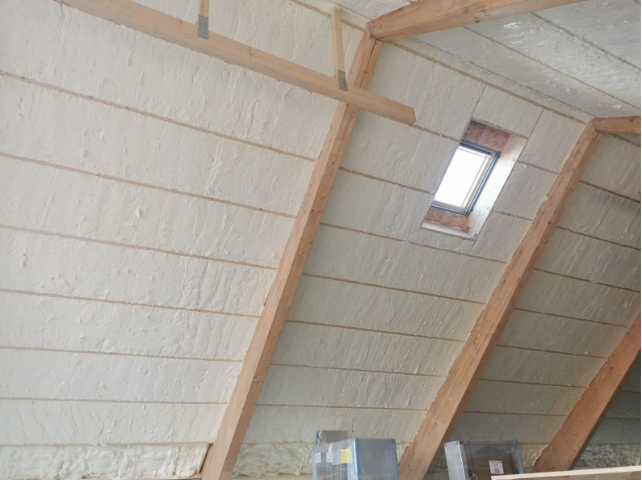 A white wall with wooden beamsAI-generated content may be incorrect.