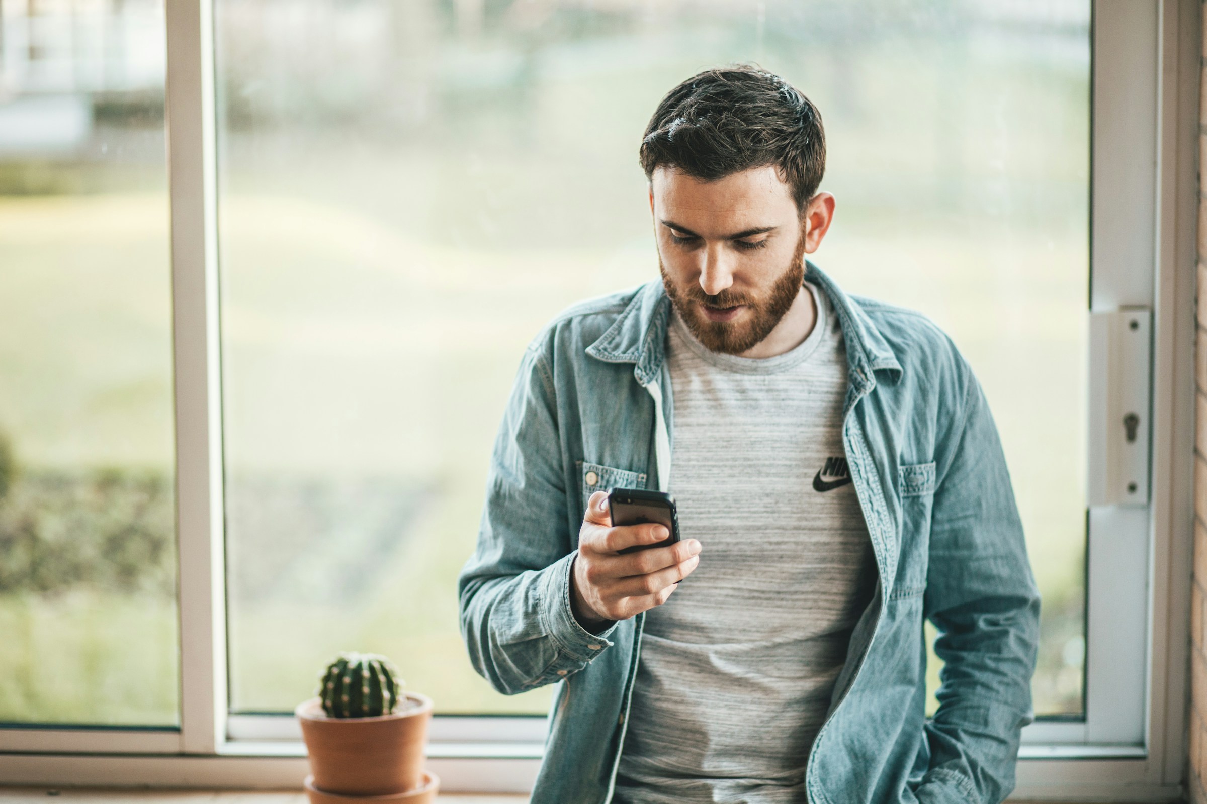 man using phone - Mass Delete Gmail